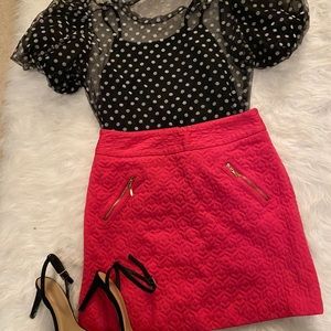 Pink mini skirt with gold zippers